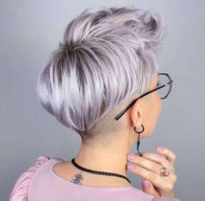 a pink blouse and a short haircut 3