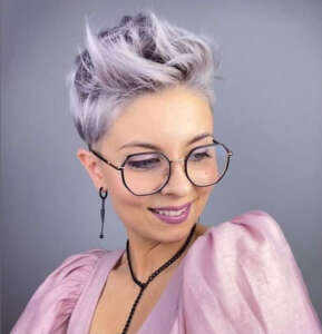 a pink blouse and a short haircut 4